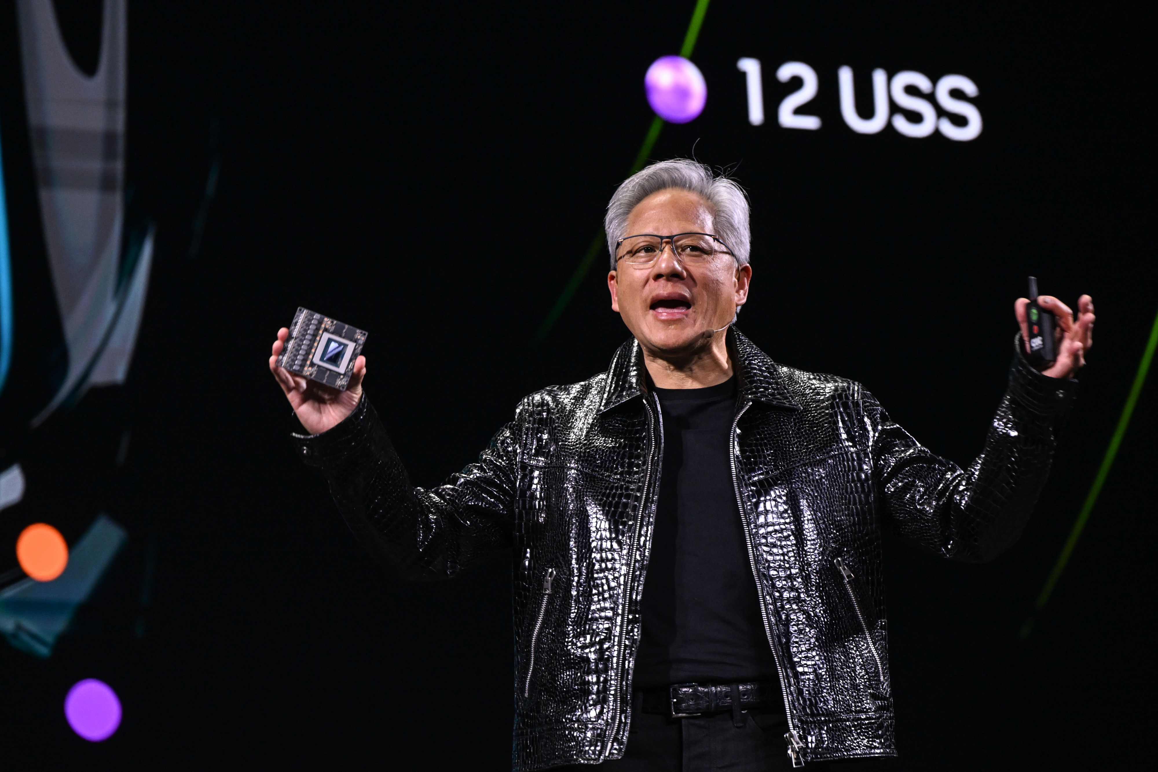 Nvidia CEO Jensen Huang presenting a new computer chip at CES.