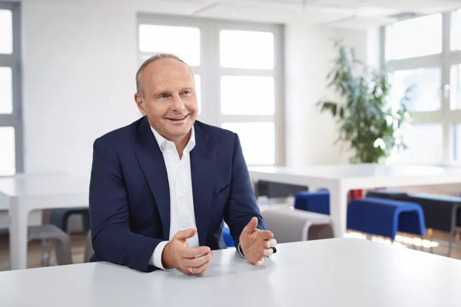 Dirk Hahn, CEO of Hays, seated at a table.